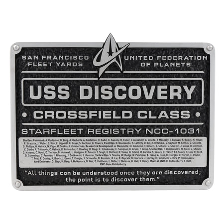 Front view of the U.S.S. Discovery dedication plaque replica featuring the ship registry and Starfleet delta insignia