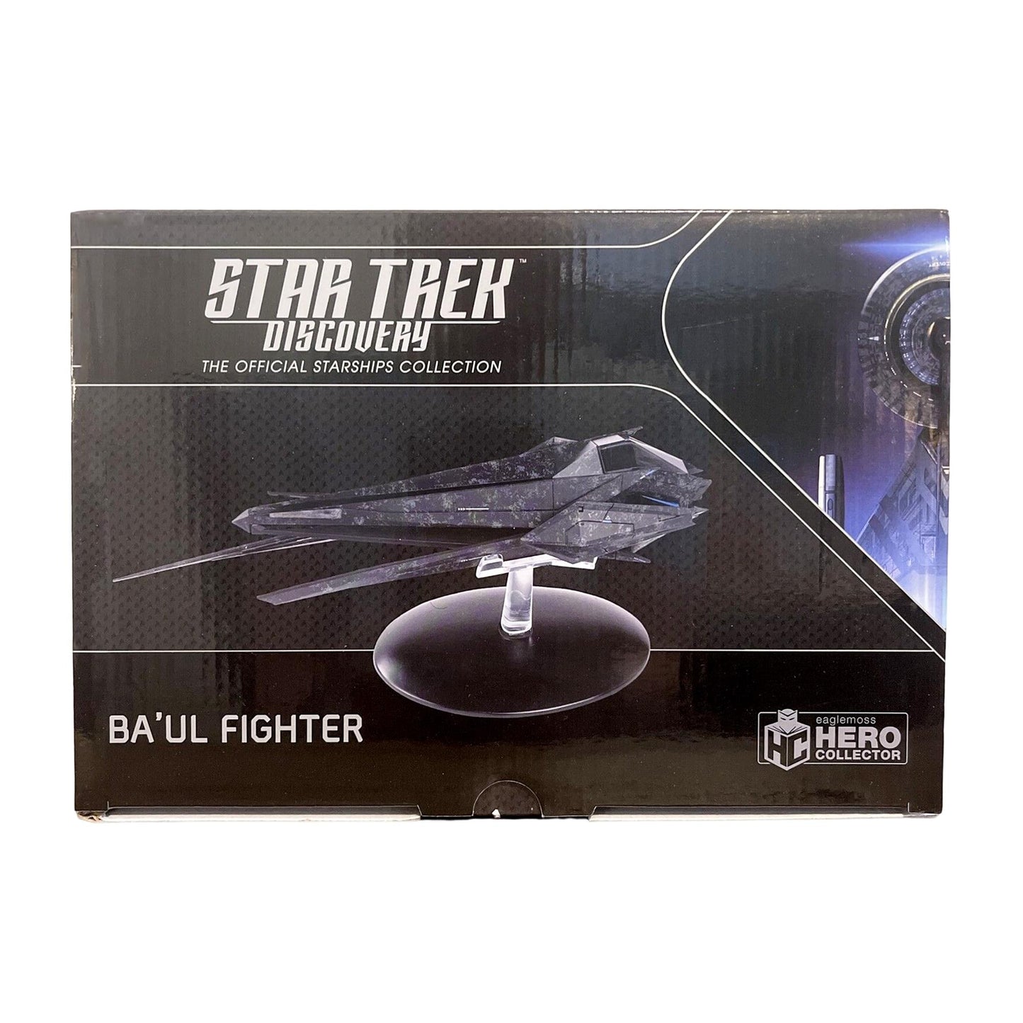 Baul Fighter model resting on its display stand against a neutral background
