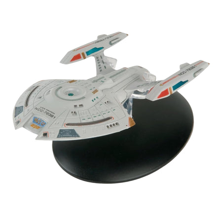 Front three-quarter view of the U.S.S. Equinox starship replica on its display stand, showcasing its compact hull and warp nacelles
