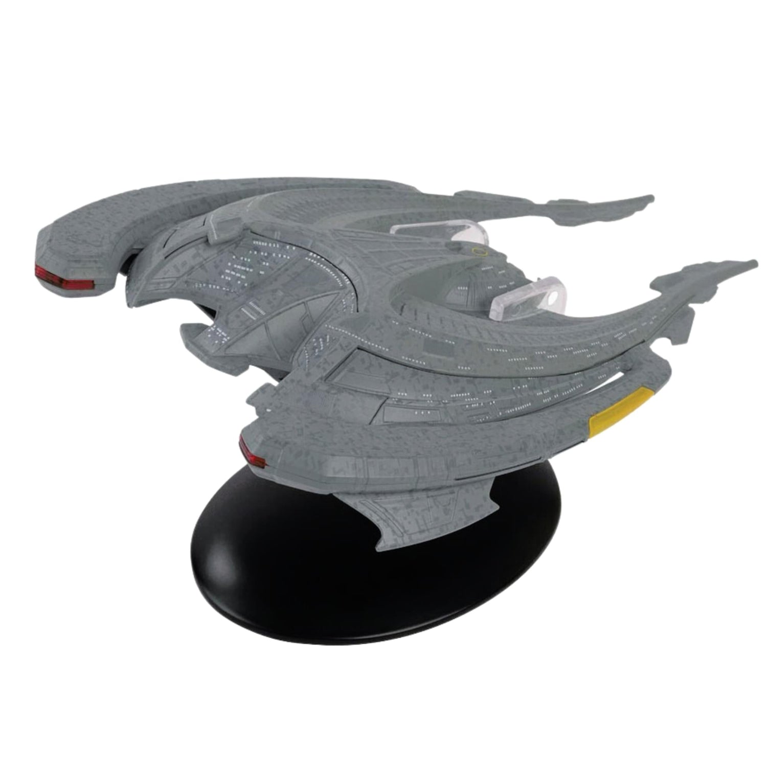 Side profile view showing the distinct aerodynamic lines and configuration of the alien vessel