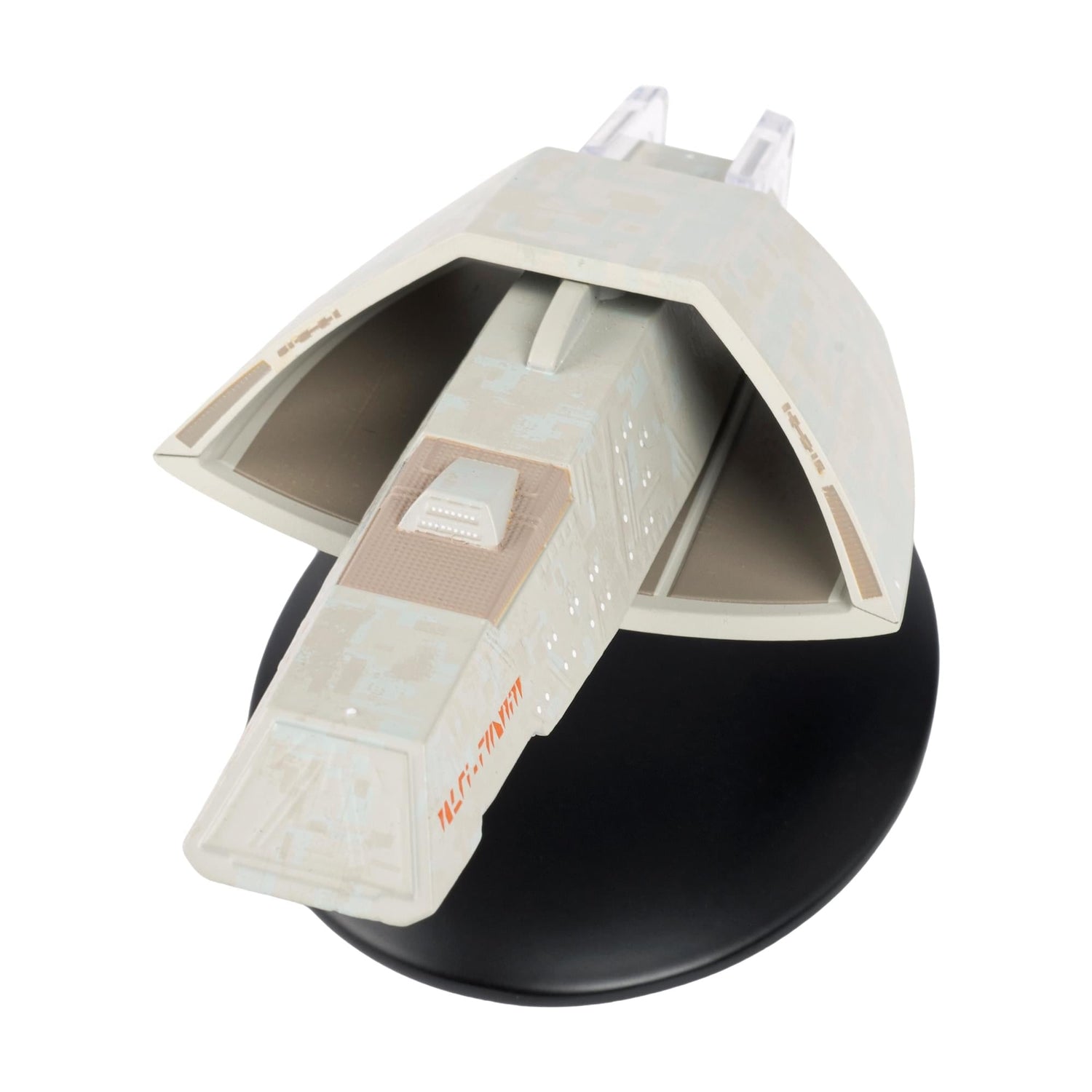 Side profile of the die-cast starship model resting on its display stand
