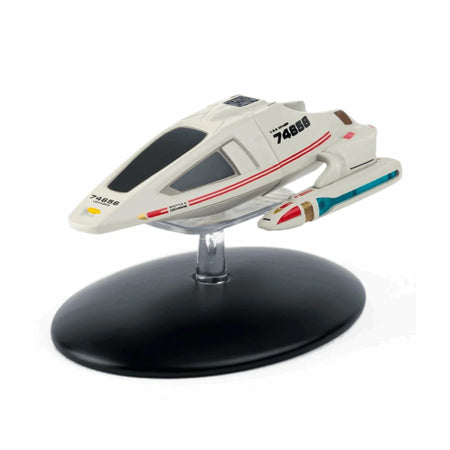 Die-cast Star Trek Shuttlecraft Cochrane model viewed from the front quarter, showcasing its aerodynamic gray hull and Starfleet registry markings