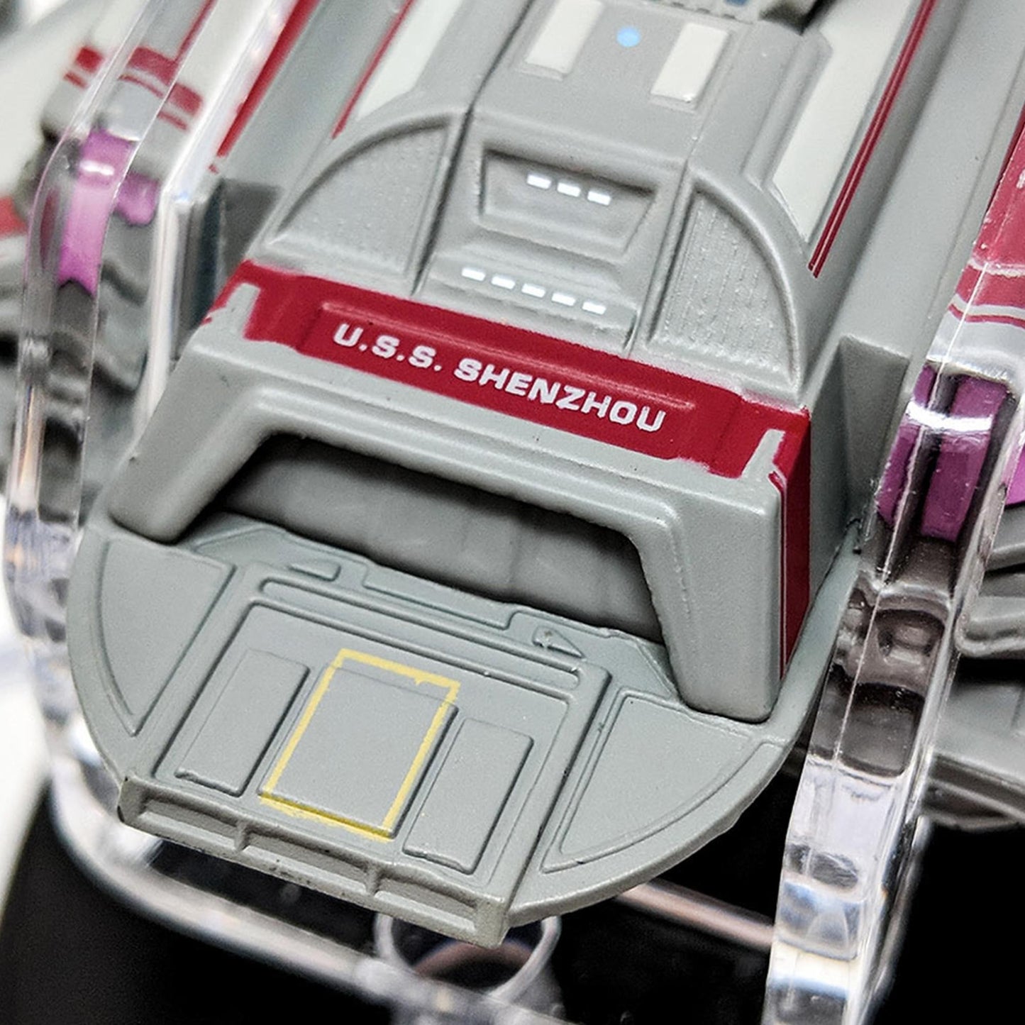 Close-up of the Starfleet registry and hull nomenclature on the saucer section