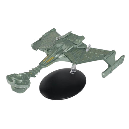 Three-quarter front view of the die-cast Klingon Battlecruiser replica, showing its distinctive forward command pod and sweeping hull wings