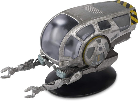 Front three-quarter view of the die-cast Worker Bee model resting on its display stand, showing crisp yellow paneling and engineering markings