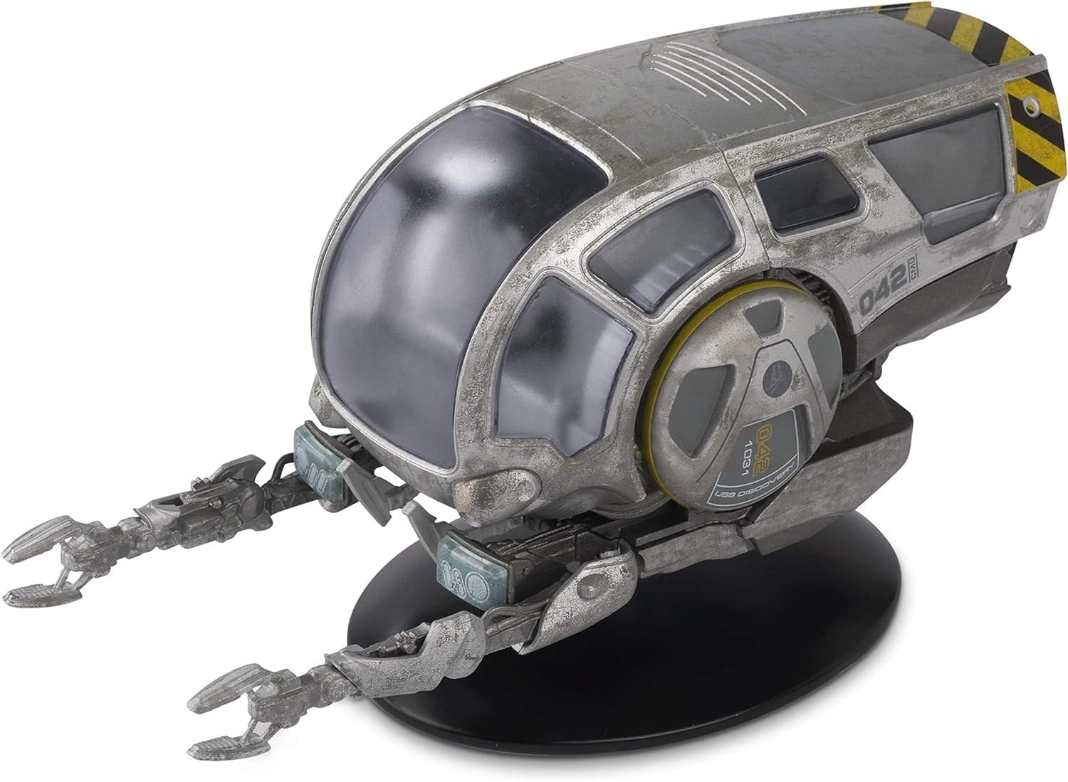 Front three-quarter view of the die-cast Worker Bee model resting on its display stand, showing crisp yellow paneling and engineering markings