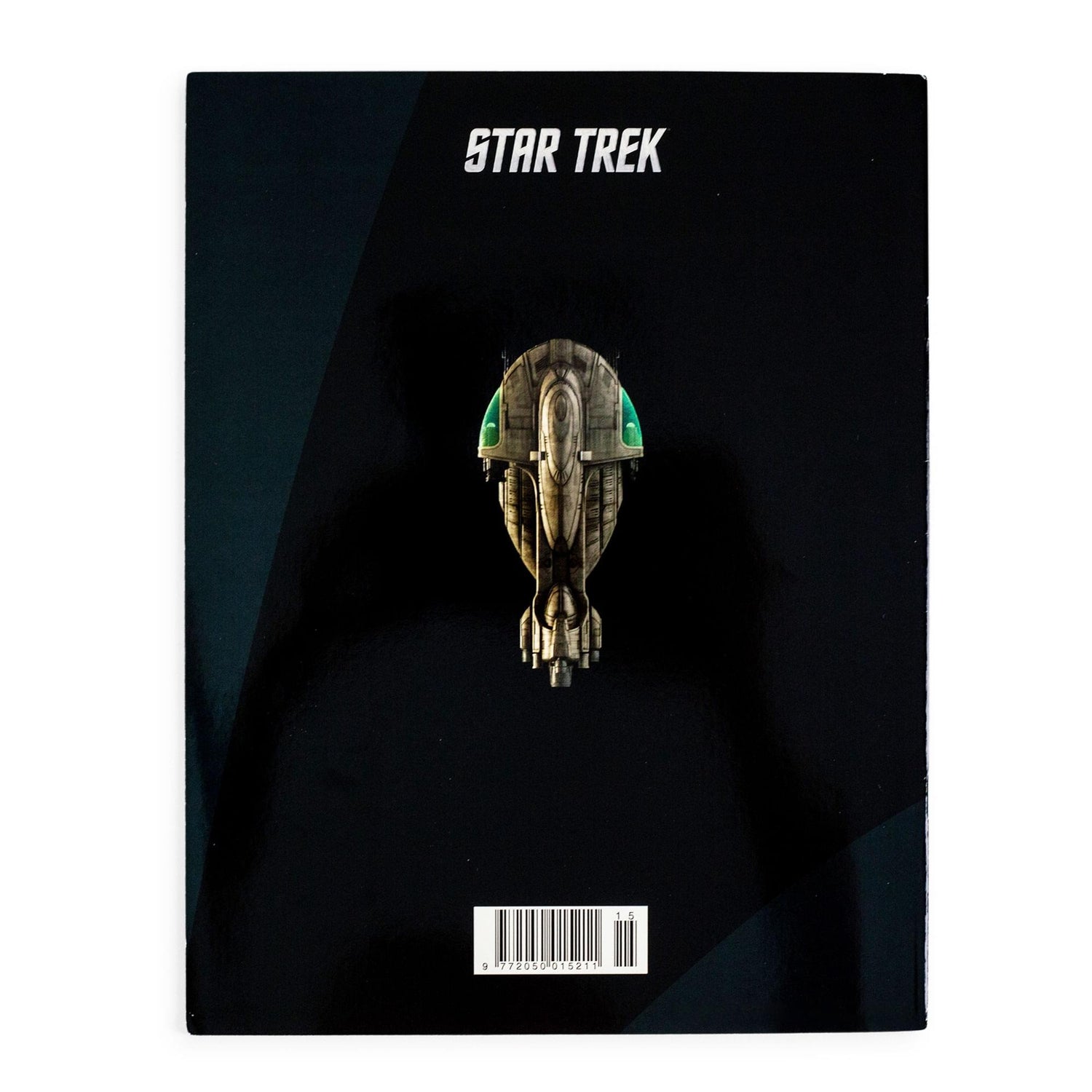 Interior spread of the Star Trek magazine showing illustrated starship schematics and lore text