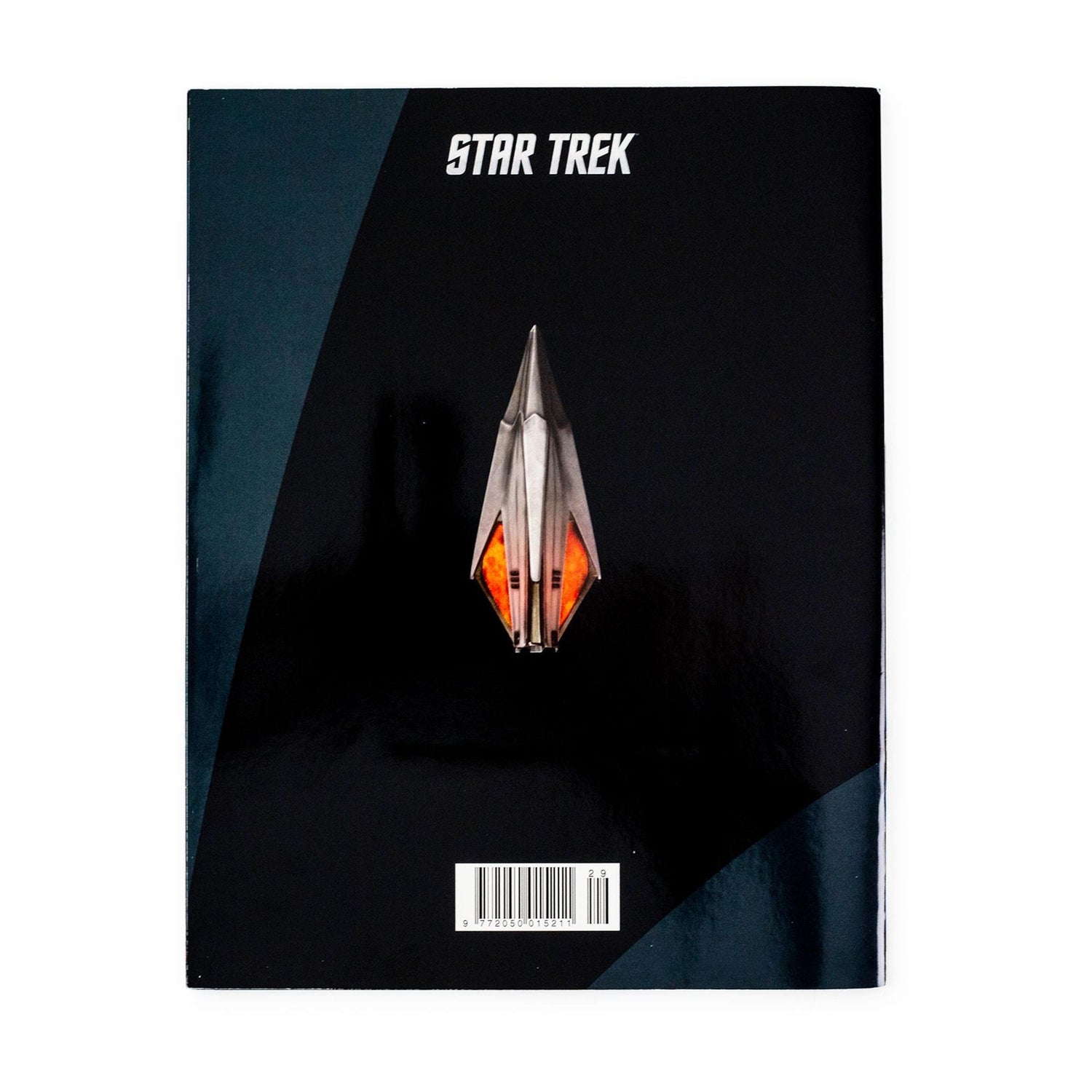 Interior page spread showcasing full-color illustrations and technical schematics of the Tholian starship
