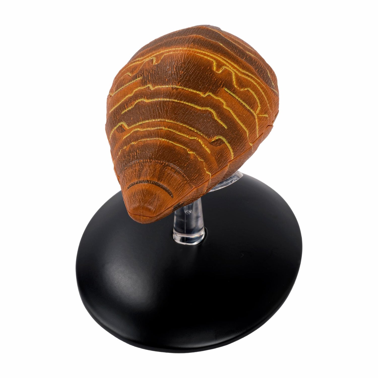 Side profile view of the Gomtuu starship collectible resting on a display base