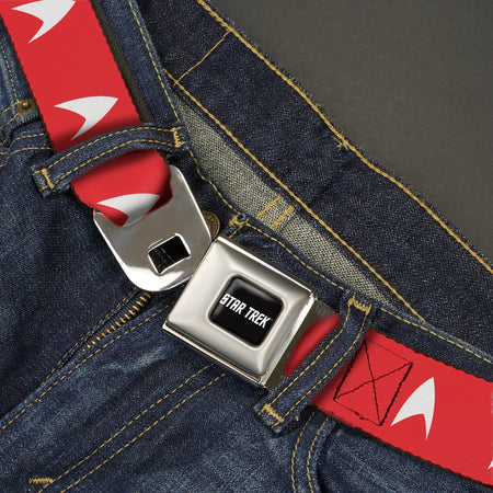 Close up of metal push button seatbelt buckle with Star Trek logo