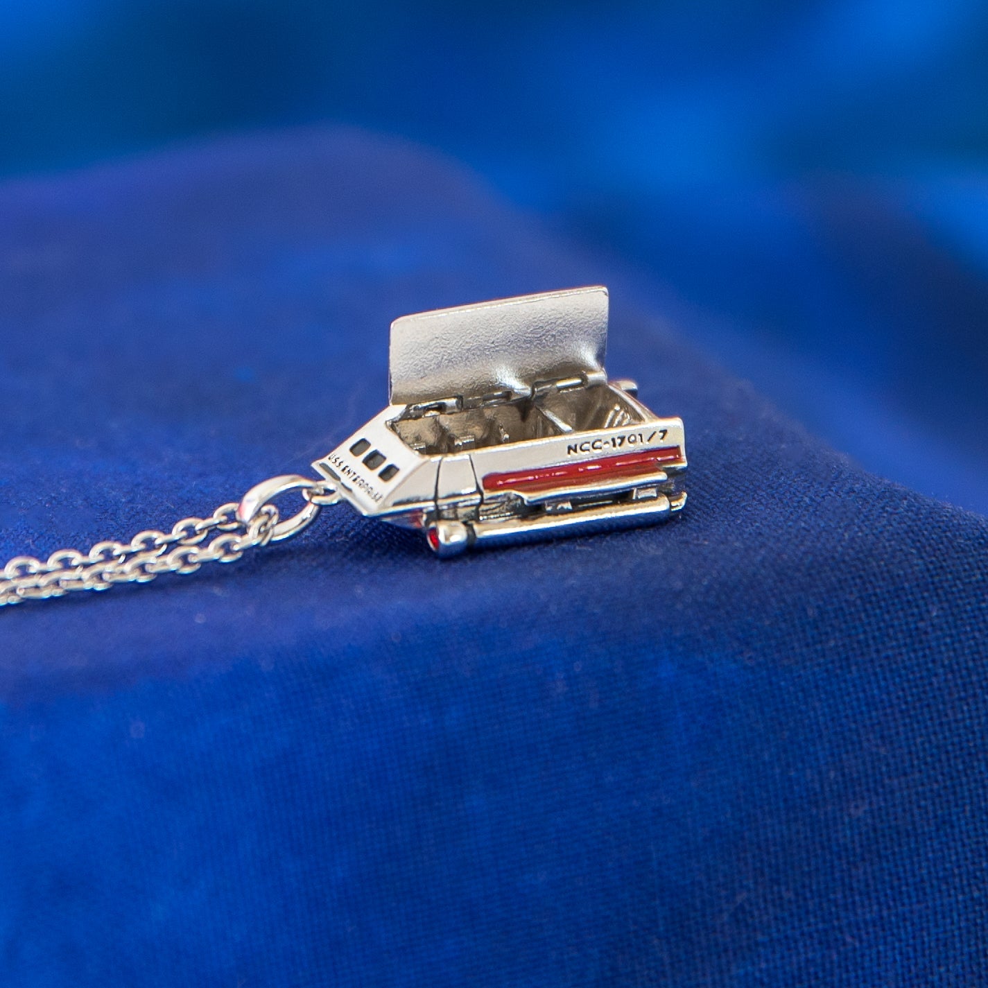 Galileo shuttlecraft necklace worn on model