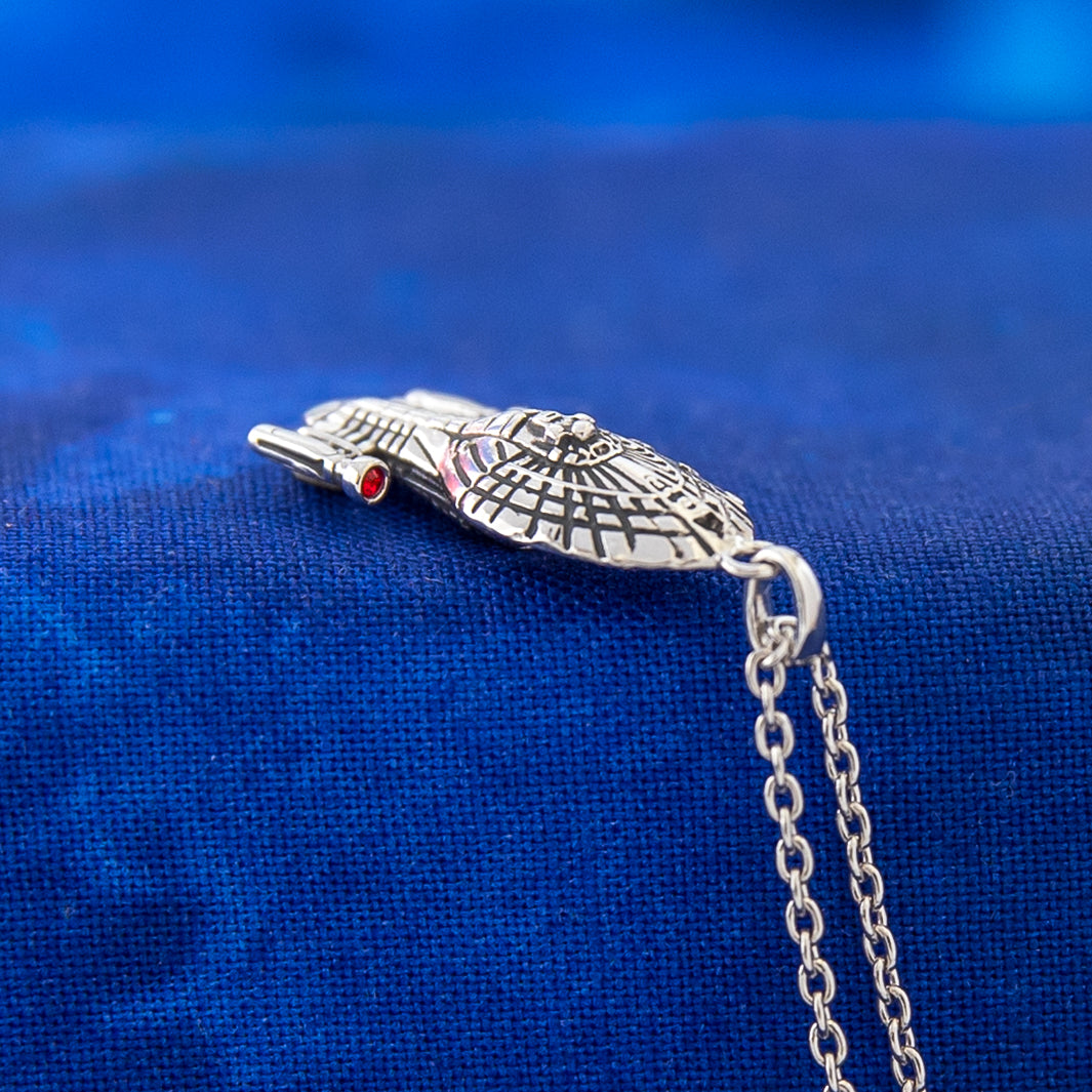 Side view of USS Voyager starship necklace detail