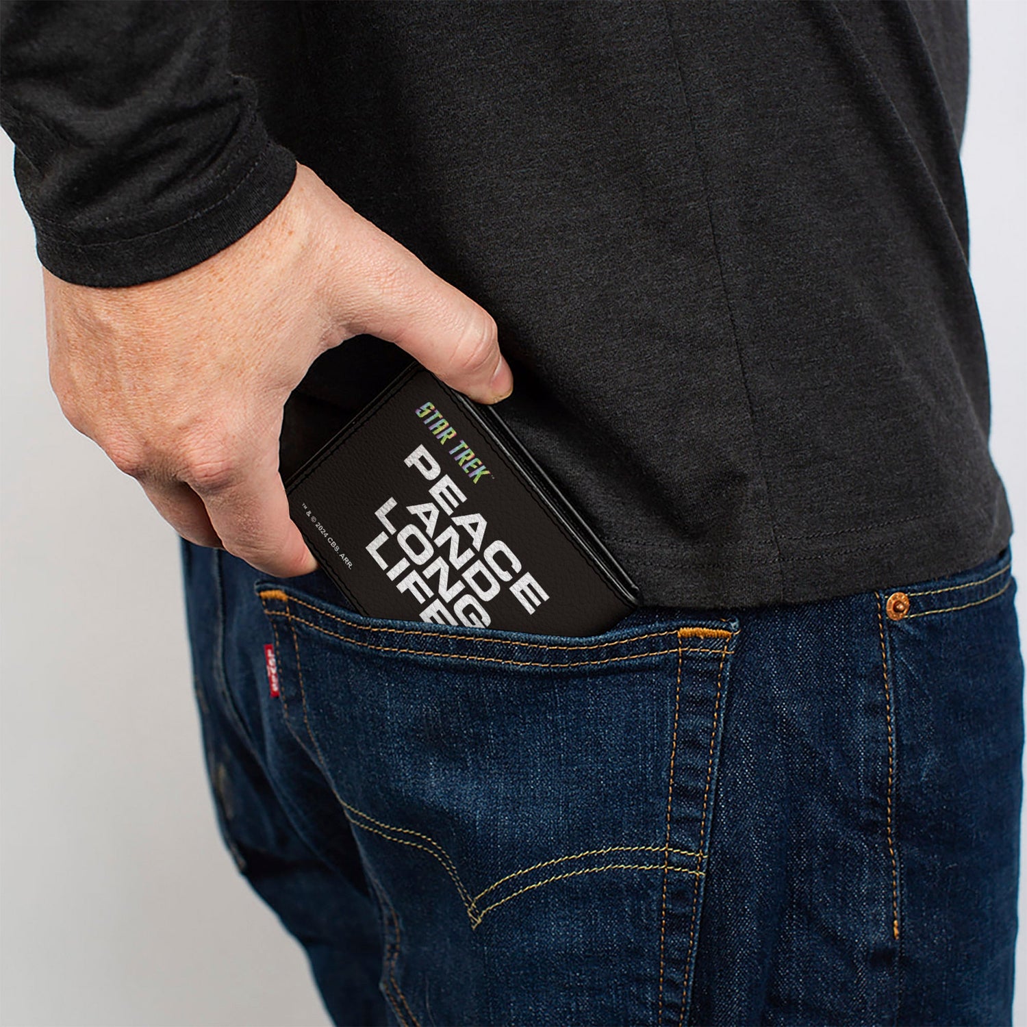 Side profile showing the slim design of the bi-fold wallet.