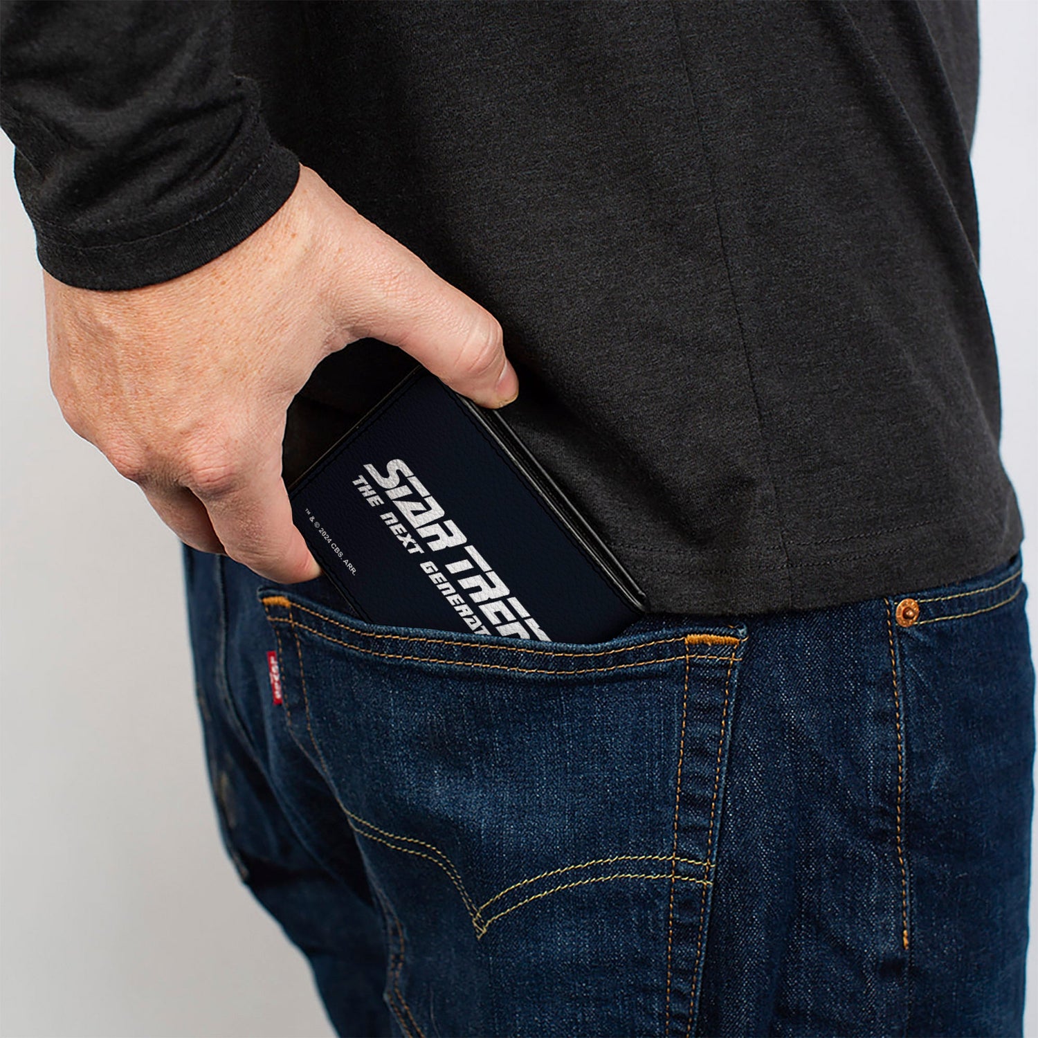 Side profile showing the slim depth of the Star Trek wallet