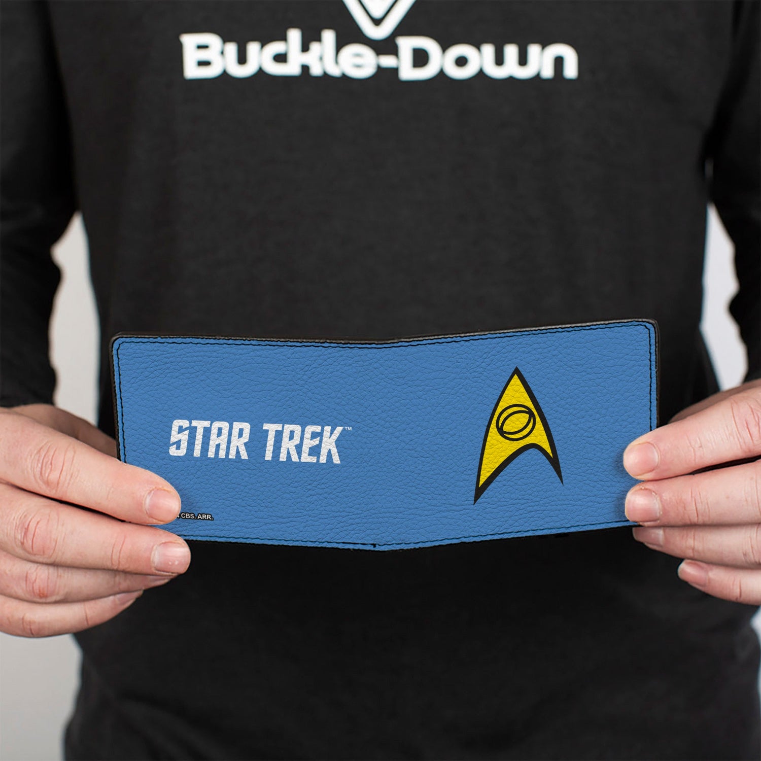 Star Trek bi-fold wallet held in hand to show scale.