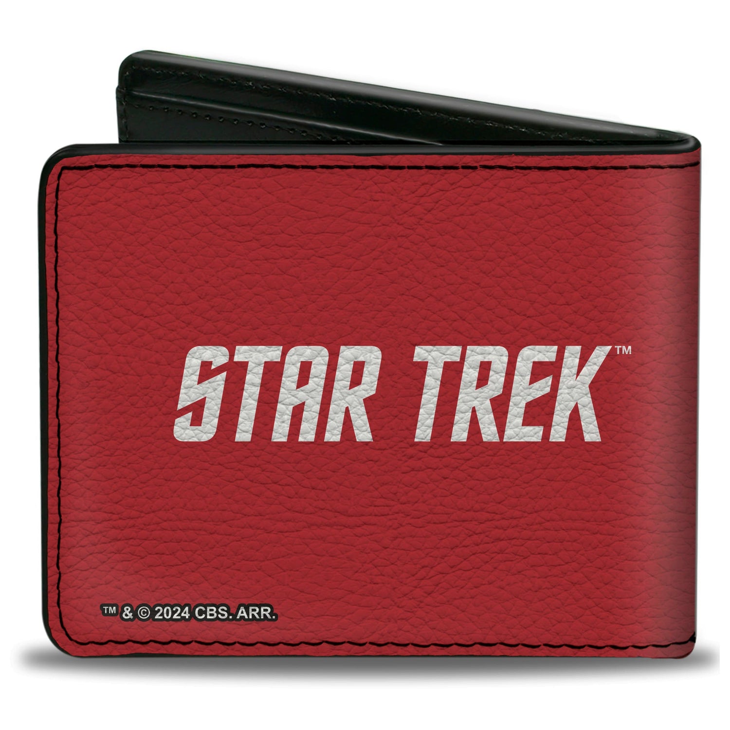 Close up of the gold Starfleet Operations Delta insignia on red background