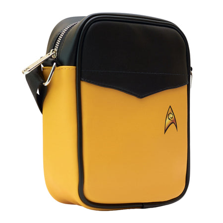 Angled view highlighting the adjustable black shoulder strap and sleek gold vegan leather.