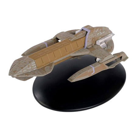 Three-quarter front view of the Karemma Starship replica showing its unique hull configuration and metallic finish