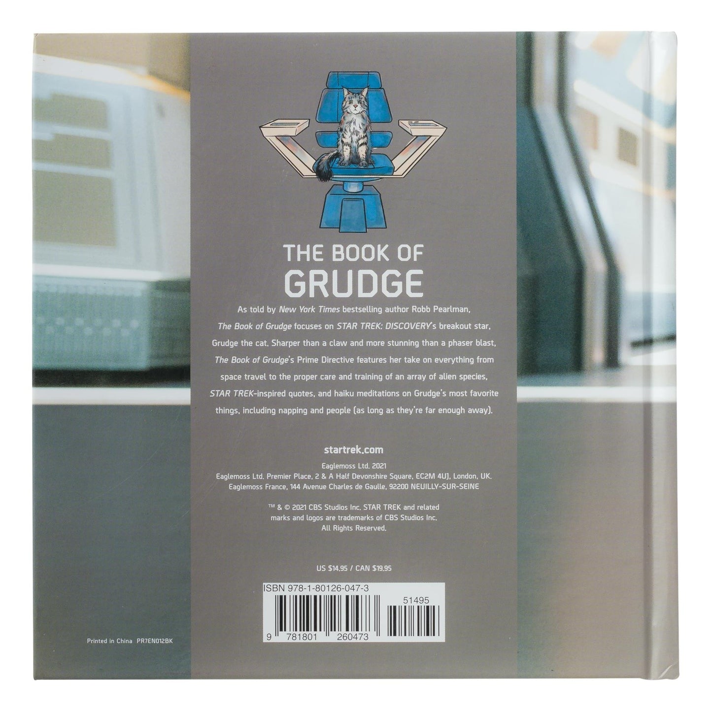 Flat lay view of the book resting against a Starfleet Command themed backdrop