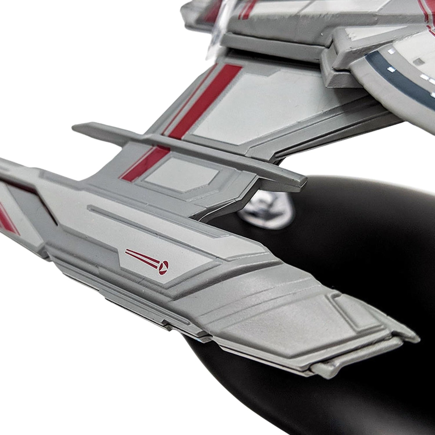 Port side profile view of the Walker-class starship resting on its branded display base