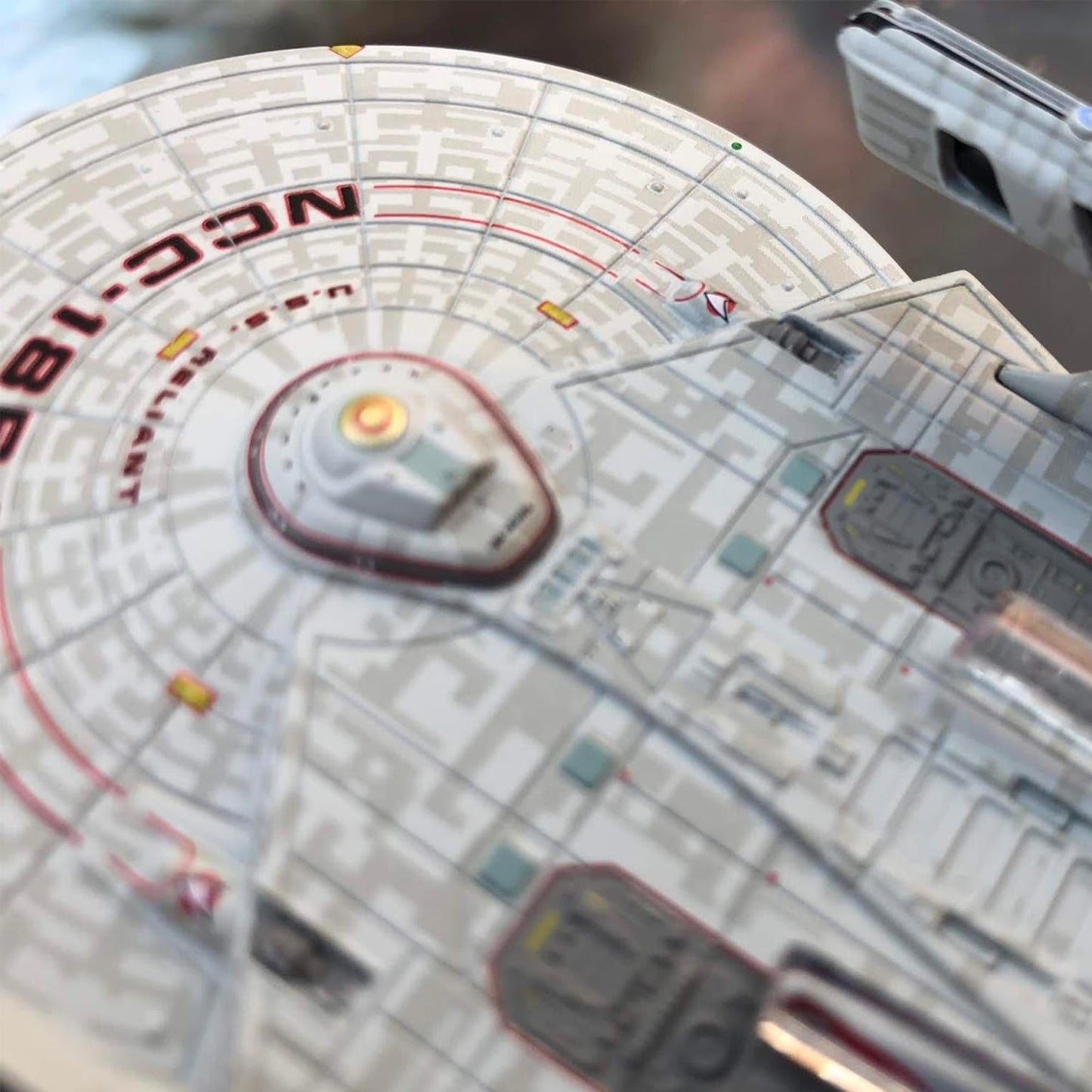 Angled profile view of the starship replica mounted on its display stand