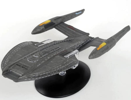 Top-down view of the USS Toussaint starship model displaying detailed hull plating, registry NCC-87111 markings, and hand-painted finishes