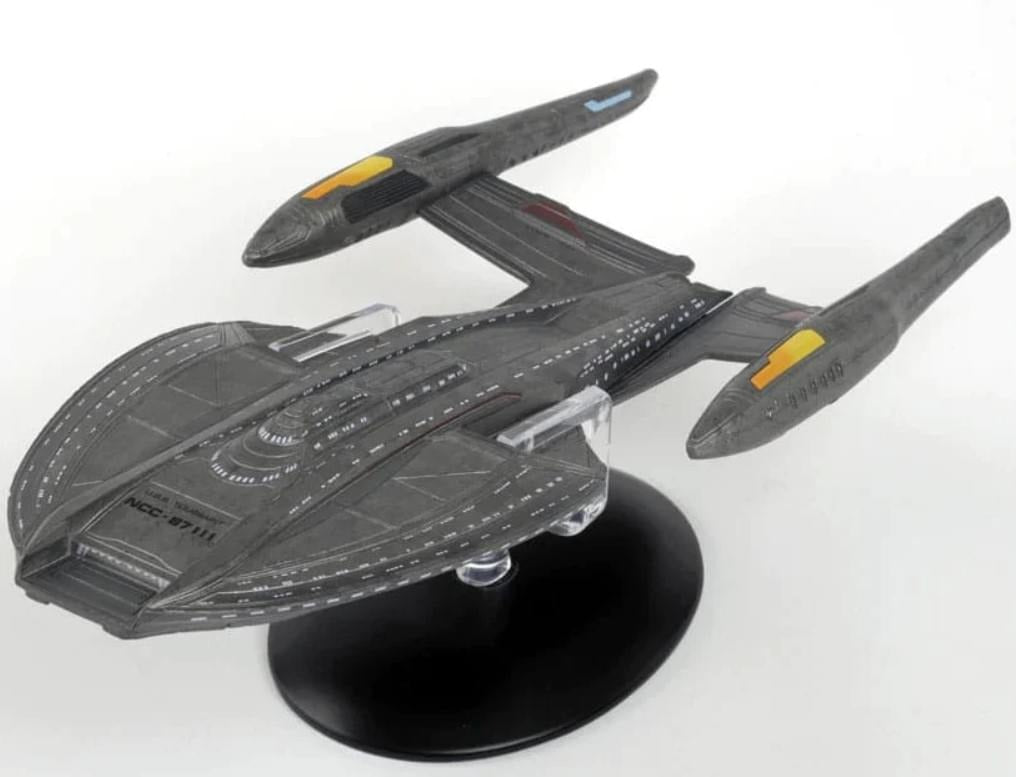 Top-down view of the USS Toussaint starship model displaying detailed hull plating, registry NCC-87111 markings, and hand-painted finishes