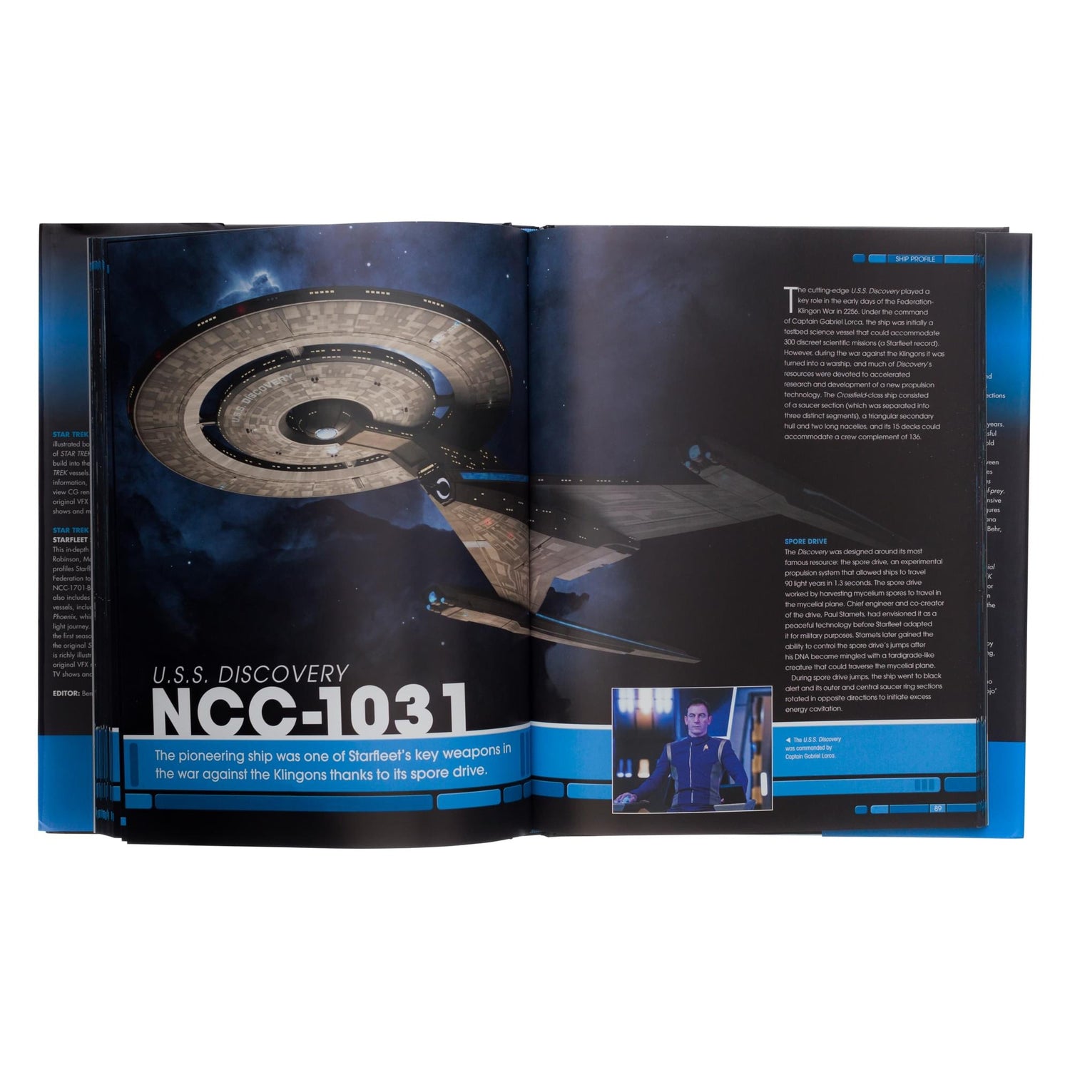 Open book pages showing technical schematics and operational history of a Starfleet starship